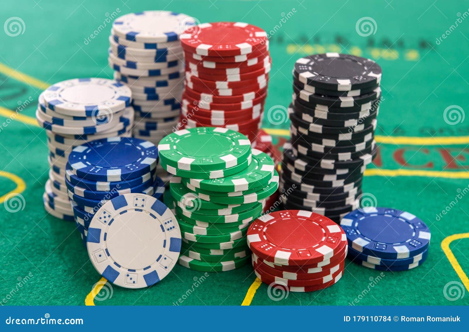 colorful casino chips on green felt table