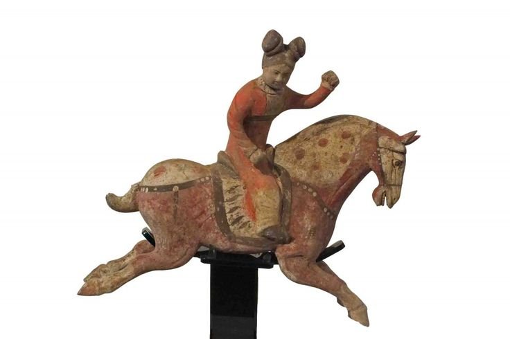polo player riding a horse gracefully