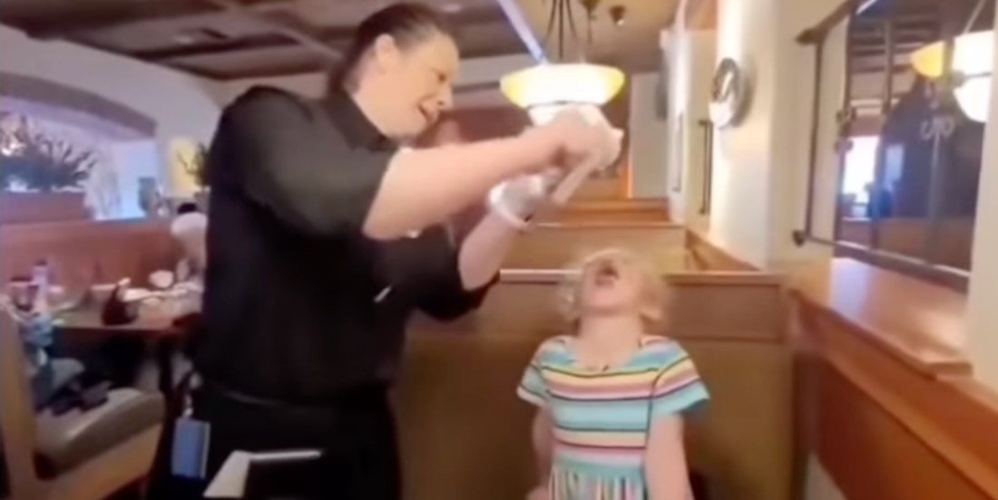 waitress serving food in olive garden restaurant